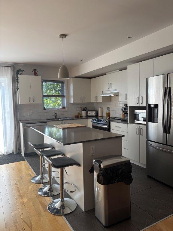 Condo sur deux étages 4 1/2 3